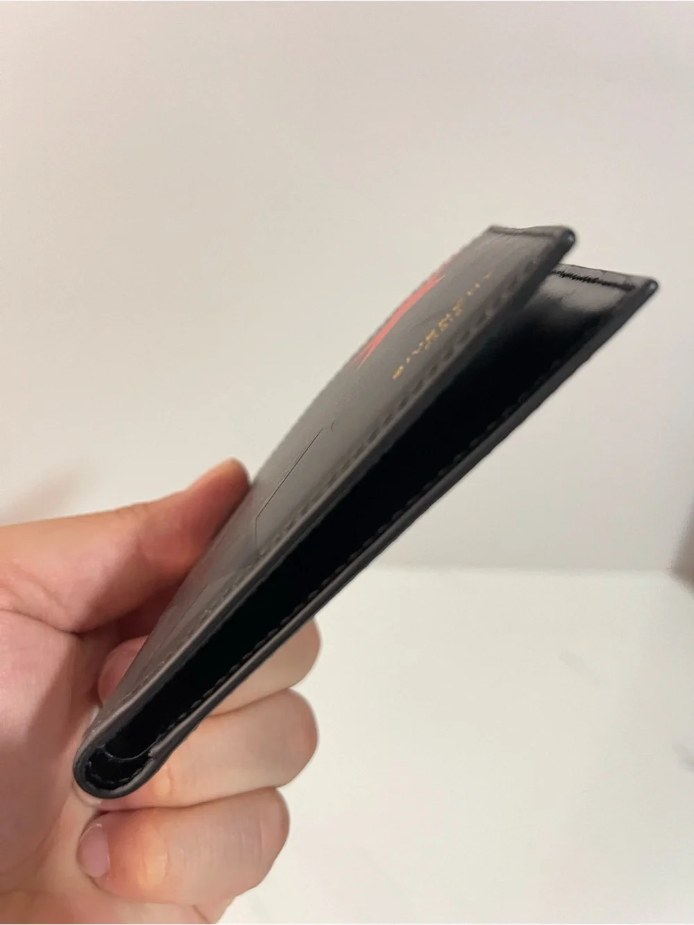 Givenchy Black Leather Wallet with Red, White & Black Star Accents